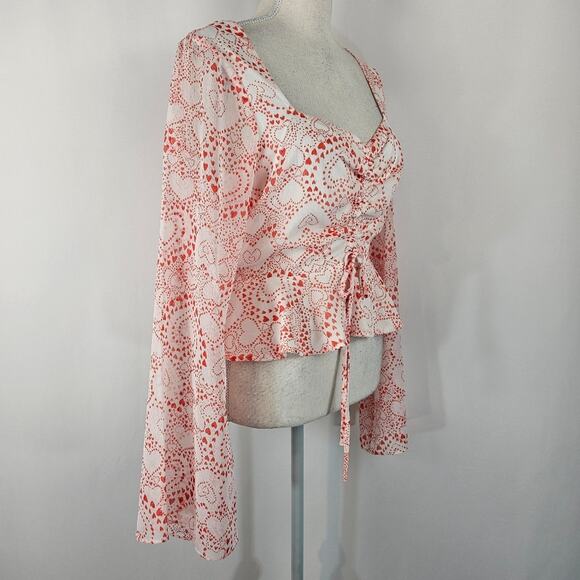 NWT BCBGeneration Heart Print Flutter Waist Peplum Sheer Fluted Sleeves Top M - Picture 4 of 13